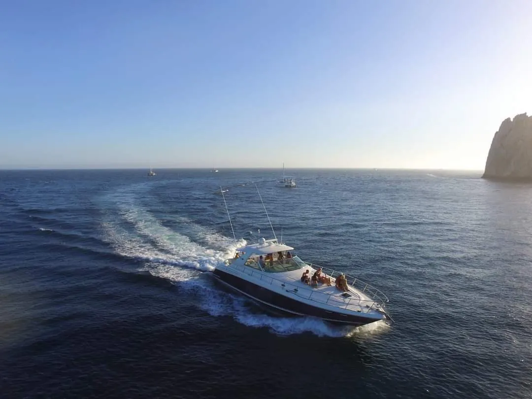 The yacht running past Lands End at sunset